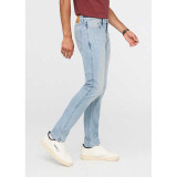 The DUER Men's Performance Denim Slim Fit Jeans in the Desert Stone Blue Wash