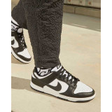 The Nike Men's Dunk Low Retro Shoes in Black and White