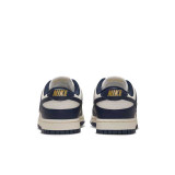 The Nike Women's Dunk Low Retro Shoes in Navy and Sail White