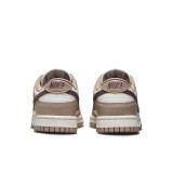 The Nike Women's Dunk Low Retro Shoes in The Sail and Plum Colorway