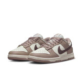 The Nike Women's Dunk Low Retro Shoes in The Sail and Plum Colorway