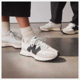 The New Balance Women's 327 Sneakers in White and Black