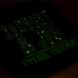 The Racquet & Jog Halloween 2024 Tee in Black with Green Glow-in-the-Dark Print