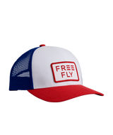 The Free Fly Youth Wave Trucker Hat in Bright Red