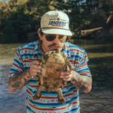 The Sendero Provisions Co. Unstructured Logo Snapback Hat in White, Red, and Blue