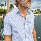 The Criquet Men's Performance Pearl Snap Shirt in Blue