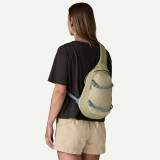 Patagonia Atom 8L Sling Bag in weathered stone, shown from back angle.