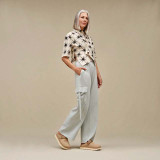 Ugg Women's Goldenstar Clogs in Sand back view