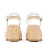 The Sorel Women's Sunpeak Wedge Ankle Sandals in Chalk and Gum
