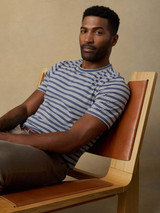 Faherty Men's Sunwashed Regenerative Tee in Whitecap Navy Stripe on model
