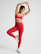 Beyond Yoga Women's Spacedye Strappy Sports Bra in Chili Red Heather front view