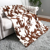 Cow Print Throw Blanket in Brown and White folded detail