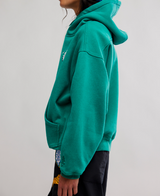 FP Movement Final Call Front Logo Hoodie Final Call Green Glow side