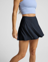 Beyond Yoga Women's Flounce This Way Skirt in Nocturnal Navy, side view
