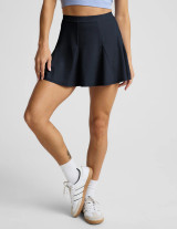 Beyond Yoga Women's Flounce This Way Skirt in nocturnal navy, front view.