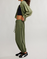 FP Movement Women's Momentum Pants in ivy green, side view