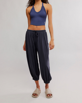 FP Movement Women's Momentum Pants in black, angled side view