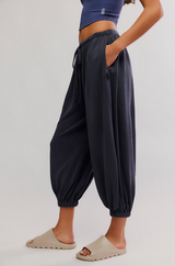 FP Movement Women's Momentum Pants in black, side view angle