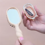 Teleties Mini Boar Bristle Hair Brush in Tan handle detail
