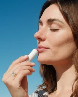 COOLA Liplux SPF 30 Tinted Lip Balm applicator close-up