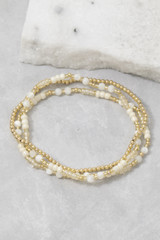 Fame Shell Bead And Gold Stretch Layered Bracelet Set in White/Gold close-up detail