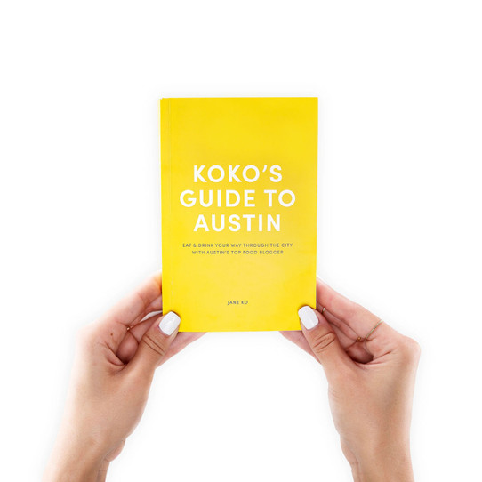 A Taste of Koko Guide To Austin travel book cover and pages displayed.