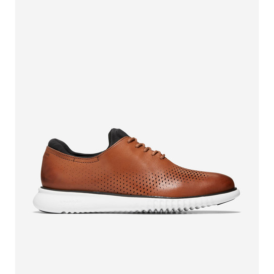 The Cole Haan Men's ZERØGRAND Laser Wingtip Oxford competici shoes in British Tan leather