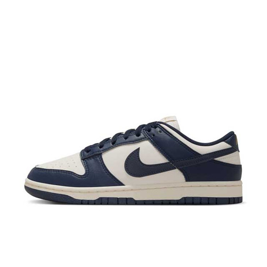 Nike Women's Dunk Low Retro Shoes in Navy and Sail White, back view
