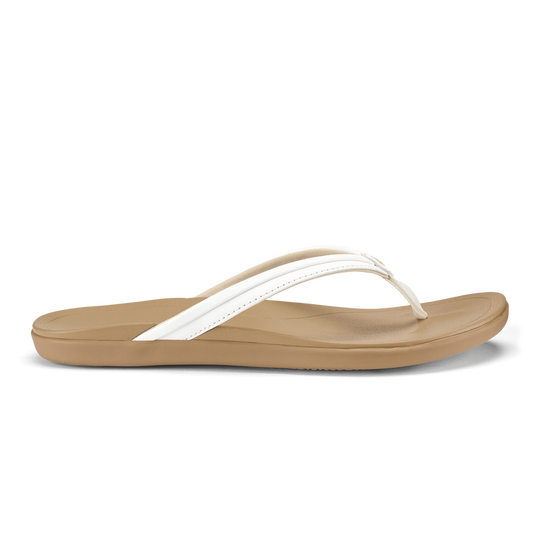 The Olukai Women's Hoʻopio Malua Sandals in Bright White and Warm Sand