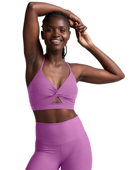 Beyond Yoga Women's Twist Strappy Sports Bra in Fun Fuschia Heather front view
