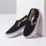 Vans Kids' Classic Slip On Shoes in black viewed from angled side perspective