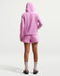 Nike Women's Sportswear Club Fleece Mid-Rise Shorts Light Magenta back view