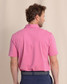 Southern Tide Men's brrr°-eeze Heather Performance Polo Shirt in Very Berry back