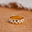 Pura Vida Checkerboard Ring in gold, angled view showing intricate pattern detail