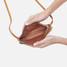 Hobo Cara Polished Leather Crossbody Bag in natural colorway