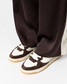 Oncept Women's Phoenix Sneakers in Espresso worn on foot