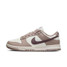 The Nike Women's Dunk Low Retro Shoes in The Sail and Plum Colorway