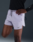 The Nike Men's Dri-FIT Stride 5 inch Brief-Lined Running Shorts in Hydrangeas