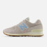 The New Balance Women's 574 Shoes in The Moonrock and Chrome Blue Colorway