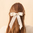 The Darling Effect Ruffle Hair Bow in Cream The Darling Effect Ruffle Hair Bow in Cream