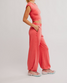 FP Movement Women's Hot Shot Crossover Set in Grapefruit side view