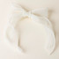 The Darling Effect Sheer Pearl Hair Bow in Cream