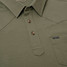 Poncho Outdoors Men's Field Polo in Jalapeno Cream with Four Leaf Clover accents, detail view
