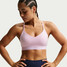 Nike Women's Indy Light Sports Bra in Pink Foam side view