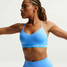 Nike Women's Indy Light Sports Bra in University Blue side view