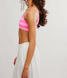 FP Movement Women's Tighten Up Reversible Bra in Hot Pink Combo side view