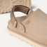Ugg Women's Goldenstar Clogs in Sand detail view