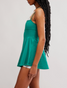 FP Movement Women's Baseline UV Tennis Dress in Green Glow back view