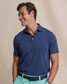 Southern Tide Men's Coastal Breeze Performance Polo in Nautical Blue side view