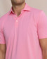 Southern Tide Men's Coastal Breeze Performance Polo in Sea Pink side view